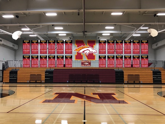 Northgate High School gym with the Bronco N logo on the court